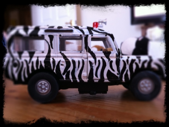 toy safari jeep with zebra stripes